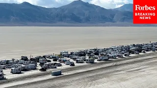 DRONE FOOTAGE: Long Line Of Vehicles Leaves Burning Man In Black Rock Desert