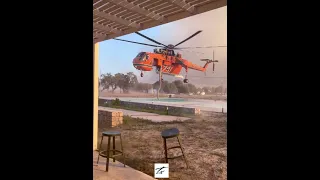 Erickson Air Crane Helicopter taking water from Hotel Pool - Rhodes wildfires