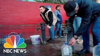Kyiv Residents Fill Up Water Bottles After Russian Strikes Damage Infrastructure