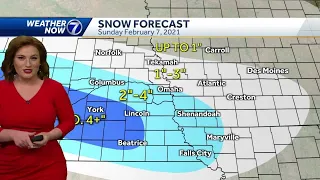 Bitterly cold wind chills and light snow Sunday