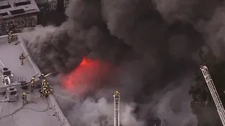 Fire crews battle fire at Sportswear store fire in downtown LA