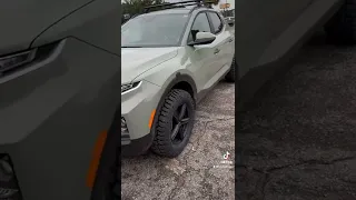 Hyundai Santa Cruz lifted on mud tires