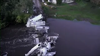 Train derails into rain swollen river in NW Iowa