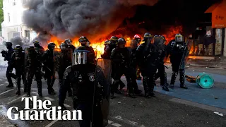 Police clash with protesters across Paris who threw petrol bombs in violent Labour Day march