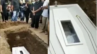 Moment corpse 'WAVES' from inside coffin sparking 'buried alive' fears