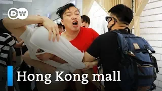 Hong Kong pro-democracy and pro-Beijing protesters clash at mall | DW News
