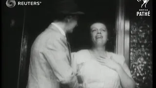 Newsreel cameramen greet lottery winner (1950)