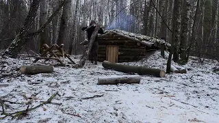 hiding in a huge dugout during a snow storm, spending the night in  bushcraft shelter * 13