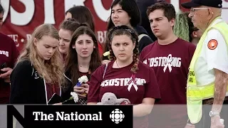 Survivors of school shooting return to class