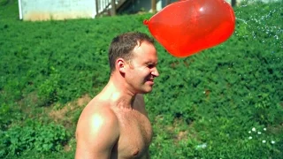 GIANT WATER BALLOON  In The Face at 10,000 fps - Slow Mo Lab (Balloon Face Pop)