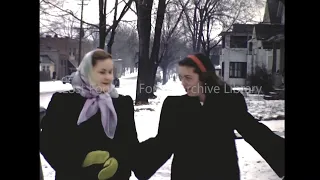 Friends Walking Together On Wintery Snowy Suburban Sidewalk in the 1940s
