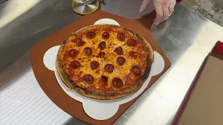 Taste testing pizza made by a robot