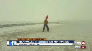 Man walks through 100 mph winds