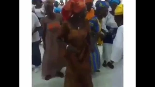 Pastor and his church members dancing shoki inside church during the sunday service