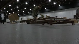 Workers building field hospital in Detroit center