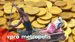 Swimming in a river of coins in India - vpro Metropolis 2011