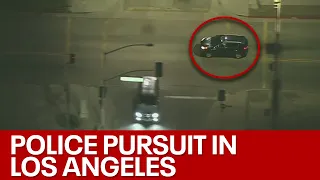 Police chase suspect ditches car while it's still running