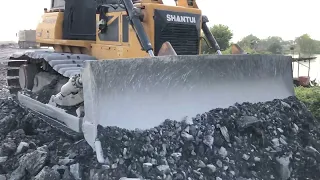 The incredible bulldozer pushing Stone into the water