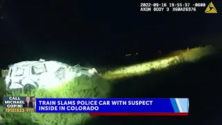 Colorado woman struck by train while being held inside police car