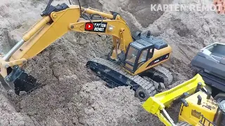 excavator besar remot dan bulldozer remot huina kerja tambang muat lumpur pasir