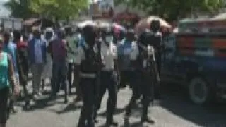 People march in Port au Prince as turf wars ease