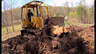 Digging out stumps with a dozer
