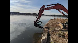 Demolition of 500' concrete seawall on Lake Harding.
