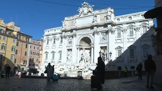 Rome's Trevi fountain almost empty as country is under lockdown | AFP