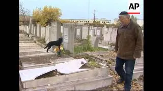 Officials say 200 graves, 100 monuments vandalised at Jewish cemetery