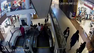 12year boy falling off escalator