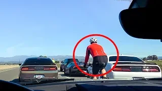 ANGRY CYCLIST GETS TRIGGERED BY SUPERCARS