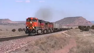 BNSF Z-train roars past at 70 mph, but trailers get a bumpy ride. Prewitt, NM. 4/24/2001