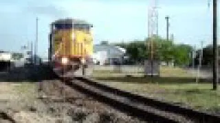 Empty rock unit train in downtown Bryan, TX