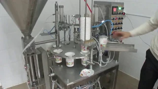 Cup Filling And Sealing Machine. Packaging equipment.