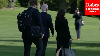 JUST IN: Biden—Flanked By Aides—Ignores Reporters' Questions As He Departs WH For Delaware Weekend