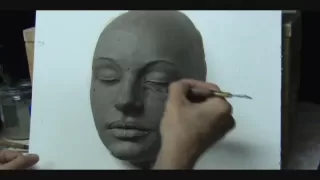 Sculpting a  female face in clay. Demo how to sculpt a face.