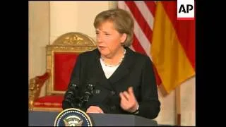 Bush, Merkel presser; Bush bite on Iraq annoucement next week