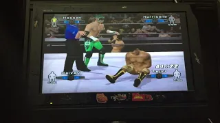 Muhammad Hassan with Khosrow Daivari vs The Hurricane with TAJIRI