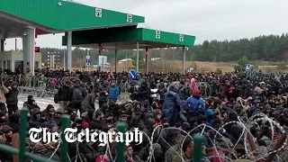 Polish border guard release video of migrant rush on border crossing with Belarus