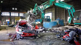 The process of crushing everything. A Japanese factory recycling cars and appliances.