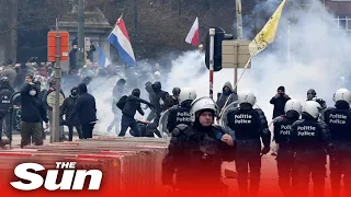Belgium Covid-19 protesters throw projectiles at riot police retaliate with water cannons