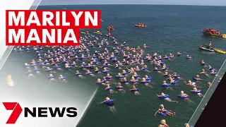 Record-breaking Marilyn Jetty Swim as hundreds of Marilyn Monroe lookalikes make a splash | 7NEWS