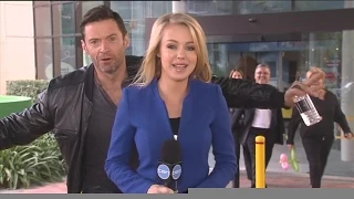 Hugh Jackman photobombs Ten News reporter Jessica Turner