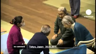 Japan's Emperor Akihito visits tsunami victims