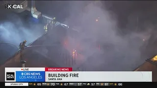 Firefighters respond to three-alarm fire at commercial building in Santa Ana