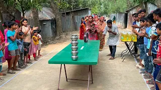 টেবিলে সাইকেলের রিং গড়িয়ে ঘটির টাওয়ার ভাঙ্গার চ্যালেঞ্জ। মহিলারা কিভাবে ৩ লিটার তেল জিতে নিল দেখুন ?