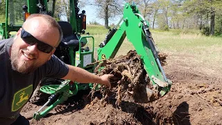 Digging Out a Stump with a Compact Tractor Backhoe