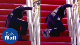 President Joe Biden FALLS up the stairs of Air Force One