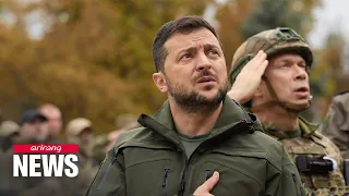 Zelenskyy visits recaptured town of Izium and honors dead; Russia strikes dam