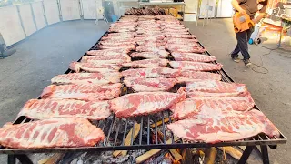 Mad Big Grill of Pork Ribs. Italy Street Food Festival